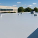 A commercial flat roof with ventilation units on a clear day